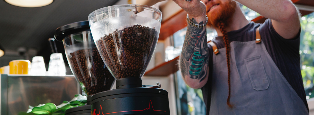 Barista Grinding Coffee Beans from Las Vegas Coffee Roaster