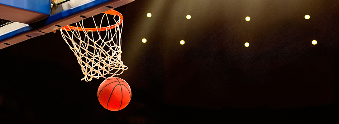 Basketball Going Through Hoop During March Hoops Game