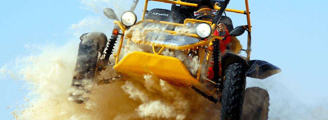 Dune buggy being driven through the sand