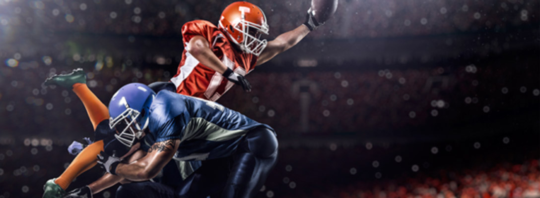 Football Players Playing in Big Game