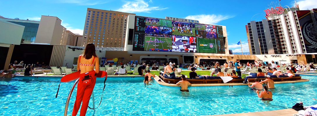 People Watching Football at Stadium Swim Pool in Vegas