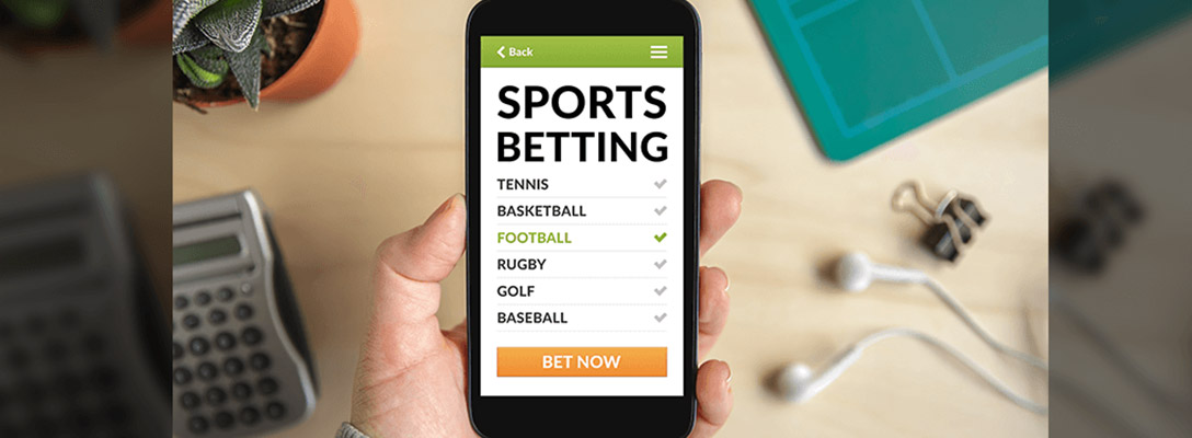 Person Placing Sports Bet for Big Game on Phone