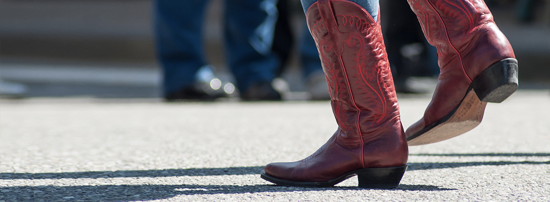 Person Walking in Red Cowboy Boots at NFR Las Vegas