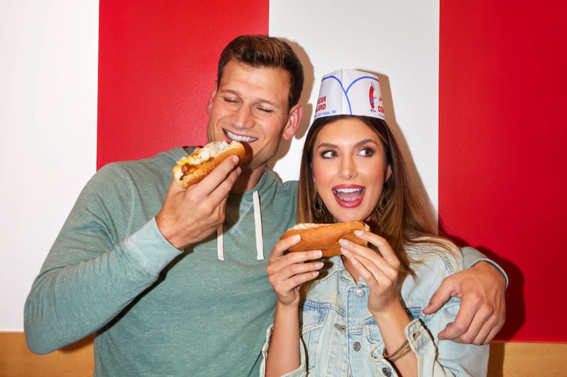 couple eating hot dogs