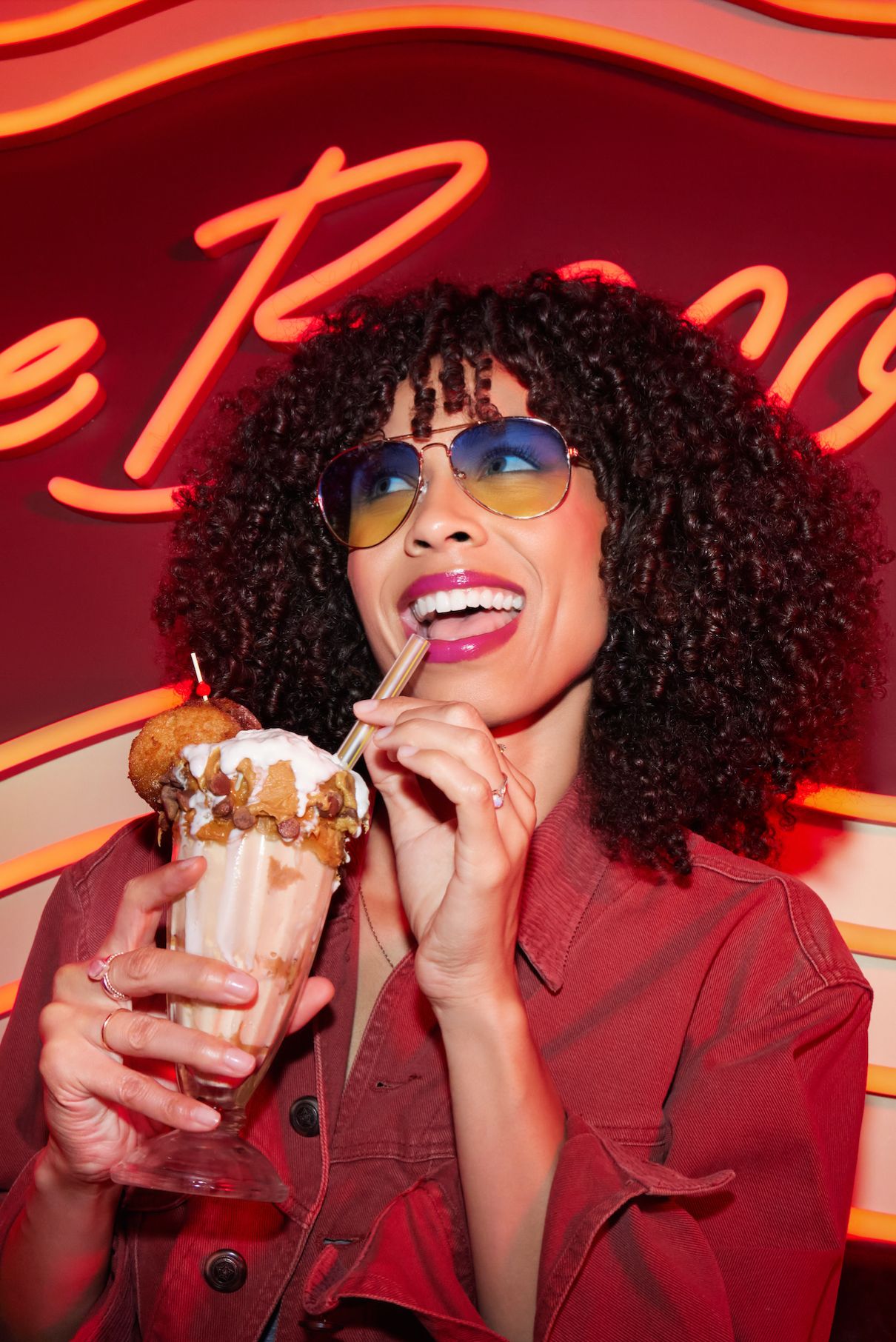 women enjoying milkshake